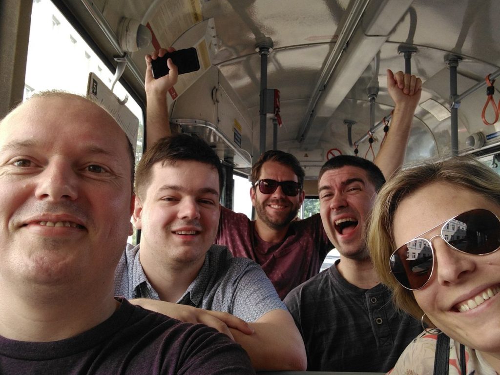 Sean, Michael, Tom C, Tom B and Amy on the metro on their way to the conference.