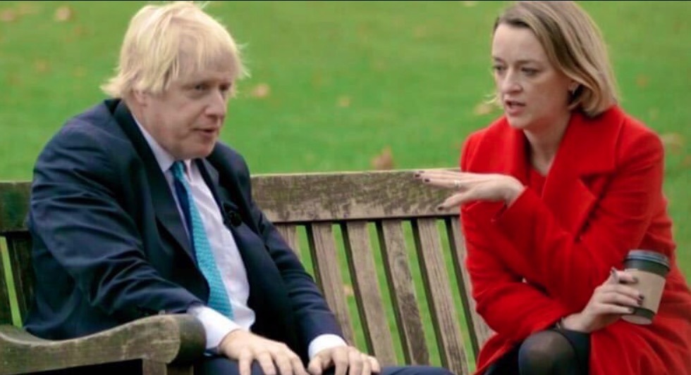 Boris Johnson and lady with red coat sitting on bench